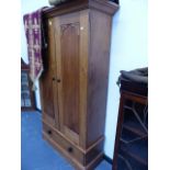 A LATE VICTORIAN PINE HALL CUPBOARD.