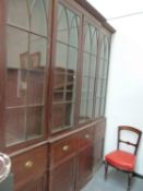 A LARGE GEORGIAN MAHOGANY BOOKCASE.