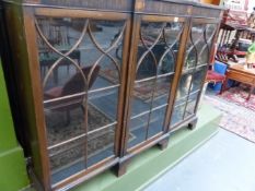 A MAHOGANY INLAID BREAKFRONT BOOKCASE.