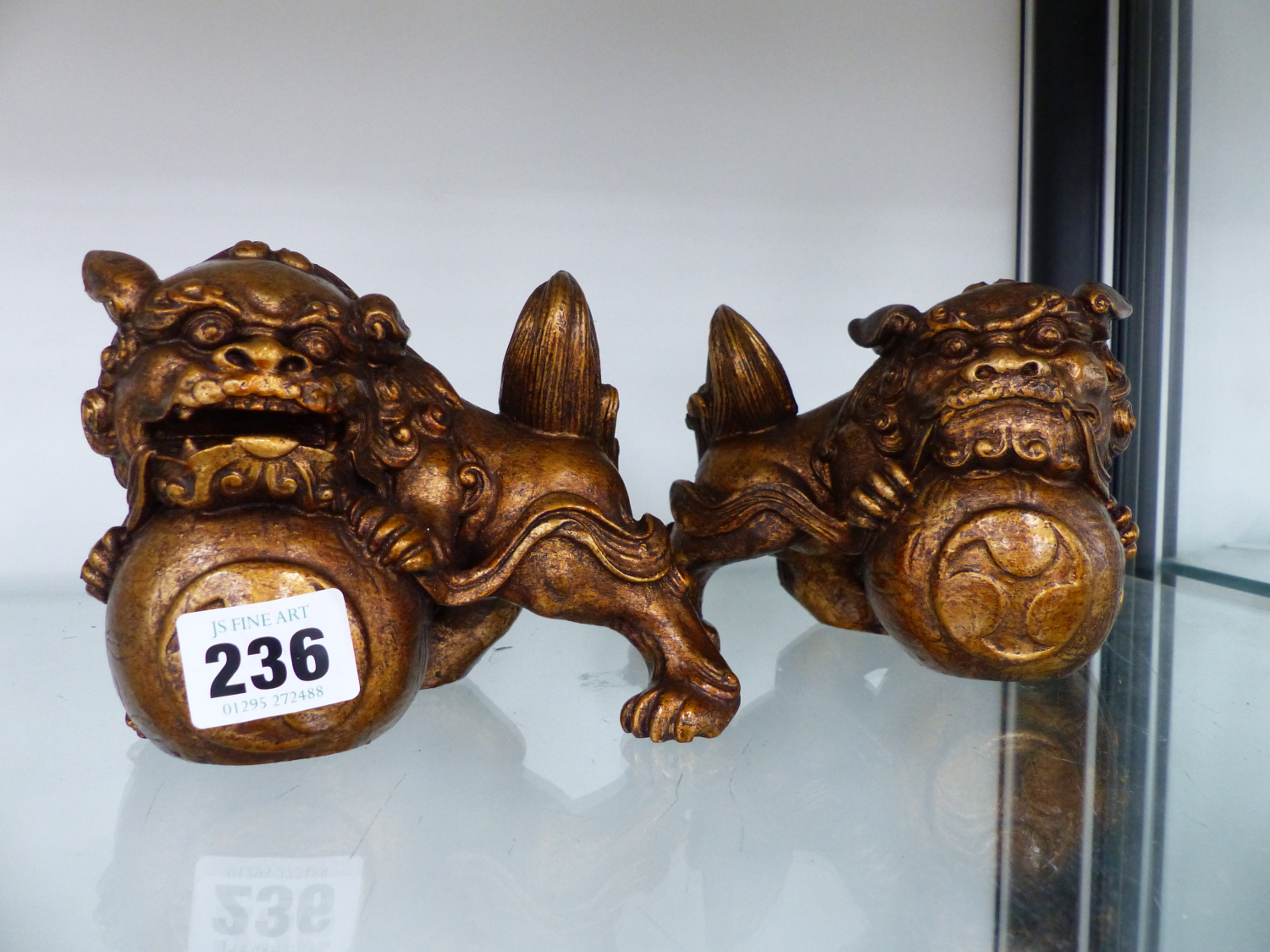 A PAIR OF ORIENTAL STYLE DOGS OF FOO.