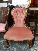 A VICTORIAN BUTTON BACK NURSING CHAIR.