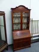 AN EDWARDIAN MAHOGANY BUREAU BOOKCASE.