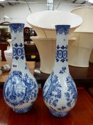 A PAIR OF BLUE AND WHITE VASES.