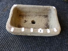 A SMALL STONE SINK.