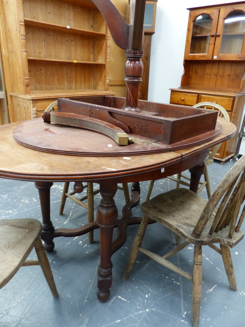 AN ANTIQUE FRENCH MAHOGANY DINING TABLE AND A DROP LEAF TABLE