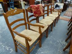 A SET OF SIX RUSH SEAT DINING CHAIRS.