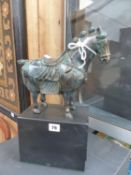 AFTER THE ANTIQUE BRONZE HORSE ON SLATE PLINTH.