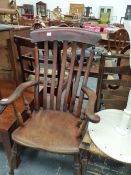 A VICTORIAN LATHE BACK KITCHEN CHAIR.