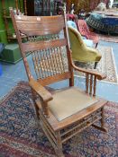 A LATE VICTORIAN ROCKING CHAIR.