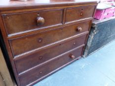 A VICTORIAN MAHOGANY CHEST OF DRAWERS.