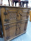 A TITCHMARSH & GOODWIN BESPOKE OAK FOUR DOOR CABINET.