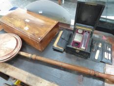 A ROSEWOOD WRITING BOX AND A LEATHER BOUND DRESSING CASE.