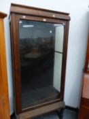 AN OAK DISPLAY CABINET.