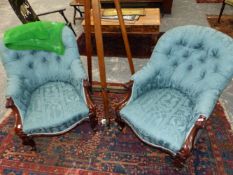 A PAIR OF VICTORIAN CARVED SHOW FRAME BUTTON BACK ARMCHAIRS.