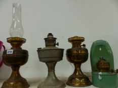 FOUR OIL LAMPS.