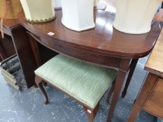 A REGENCY STYLE MAHOGANY FOLD OVER TABLE AND A STOOL.