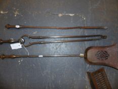 A SET OF THREE EARLY 19TH C. STEEL FIRE IMPLEMENTS WITH ASSOCIATED RESTS AND A SMALL SERPENTINE