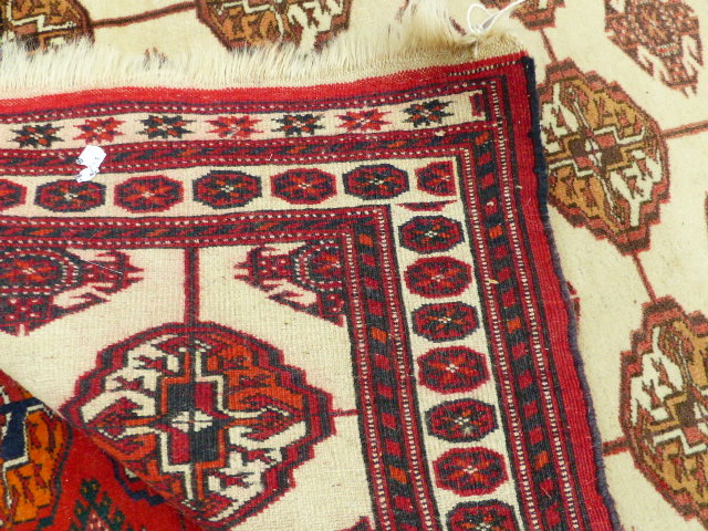 A TEKKE BOKHARA RUG. 140 x 107cms TOGETHER WITH TWO AFGHAN BOKHARA RUGS. (3) - Image 2 of 6