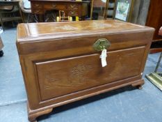 AN ORIENTAL CARVED CAMPHORWOOD BLANKET BOX. 108 x 57 x H.61cms.