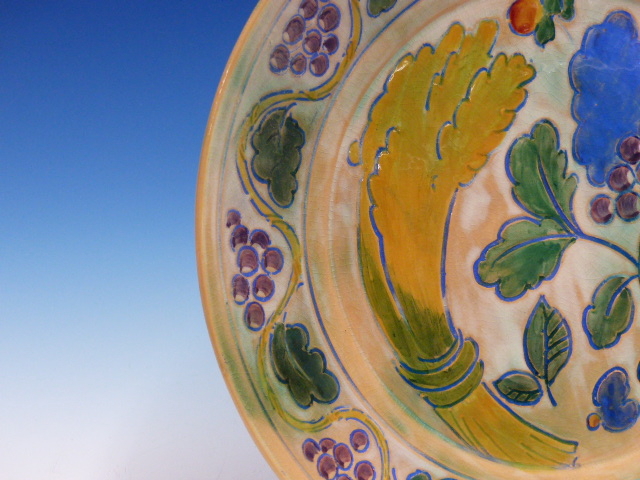 A DOULTON BRANGWYN WARE DISH WITH A WAVY BAND OF GRAPE VINES ENCLOSING A WHEATSHEAF, GRAPES AND - Image 6 of 10