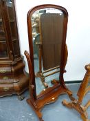 A VICTORIAN STYLE MAHOGANY FLOOR STANDING CHEVAL MIRROR.