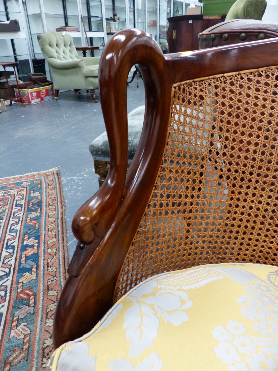 A GOOD QUALITY FRENCH STYLE HARDWOOD AND CANED SMALL CHAISE LONGUE WITH SWAN FORM ARMS AND FEATHER - Image 3 of 11