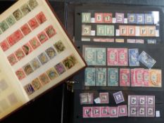 TWO ALBUMS OF SOUTH AFRICAN STAMPS DATING FROM THE REIGNS OF QUEEN VICTORIA TO THE PRESENT QUEEN.