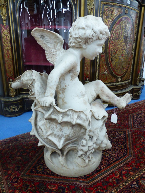 AN ITALIAN MARBLE FIGURE OF A PUTTO, TITLED 'AMOR DEL MARE' BY CESARE LAPINI, FLORENCE, DATED