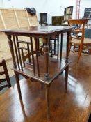 A GODWIN STYLE MAHOGANY TWO SQUARE TIERED TABLE, THE FOUR BALUSTER COLUMNS BETWEEN THE TIERS FLANKED