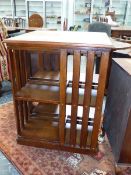 A LATE VICTORIAN OAK REVOLVING BOOKCASE. 66 x 66 x H.100cms.