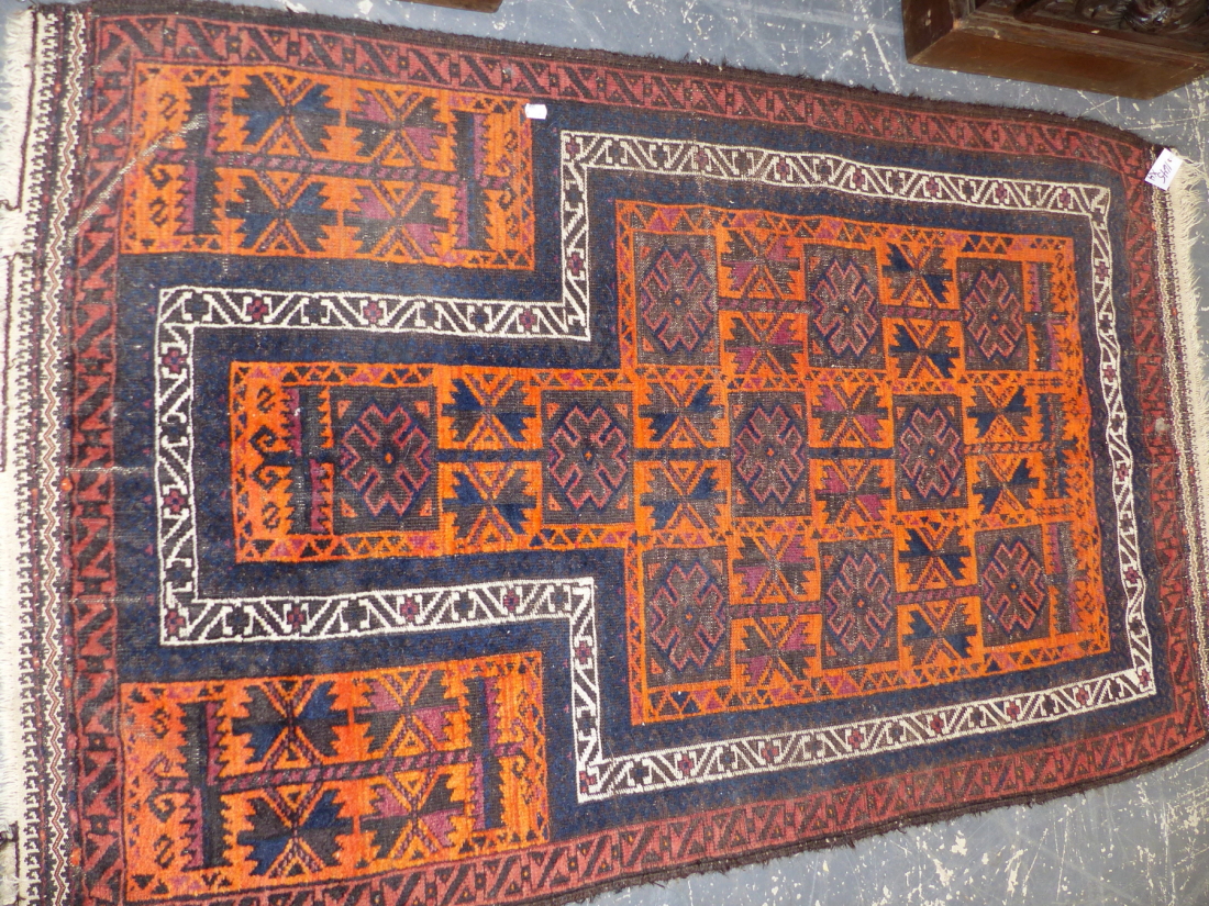 AN ANTIQUE BELOUCH RUG. 225 x 114cms TOGETHER WITH THREE TRIBAL BELOUCH PRAYER RUGS. (4) - Image 2 of 4