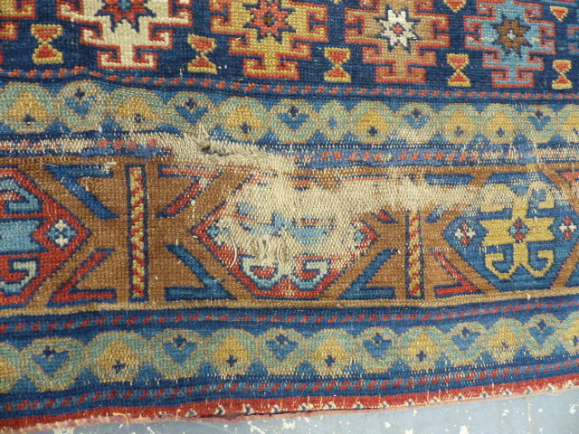 AN UNUSUAL NEAR PAIR OF ANTIQUE PERSIAN RUGS OF CAUCASIAN DESIGN. 164 x 147 & 170 x 147cms. - Image 7 of 11