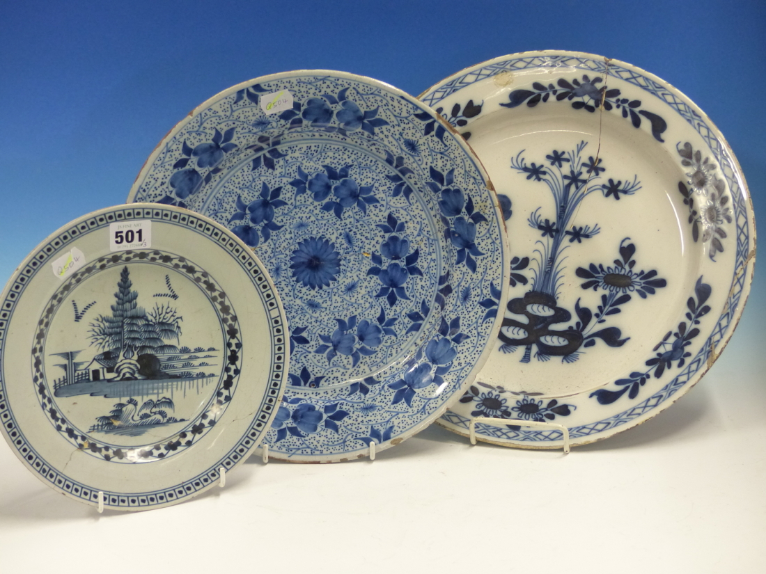 THREE DELFT BLUE AND WHITE PLATES, THE LARGEST. Dia. 34cms TOGETHER WITH A JAPANESE IMARI DISH. Dia.