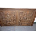 A LARGE 19th.C.DOUBLE OAK PANEL WITH CENTRAL CARVED MASKS AND GEOMETRIC MOULDINGS. 142 x 75cms.