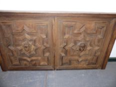 A LARGE 19th.C.DOUBLE OAK PANEL WITH CENTRAL CARVED MASKS AND GEOMETRIC MOULDINGS. 142 x 75cms.