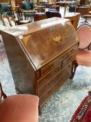 AN ANTIQUE MAHOGANY AND INLAID BUREAU WITH FITTED INTERIOR OVER FIVE DRAWERS ON BRACKET FEET. 99 x