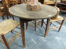 A 19th.C.PINE CRICKET TABLE WITH REMNANTS OF ORIGINAL PAINT. Dia..82 x H.76cms.