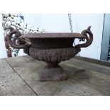 A SMALL CLASSICAL CAST IRON GARDEN URN. W.42cms.