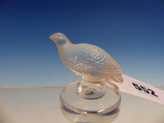 A LALIQUE FROSTED GLASS FIGURE OF A PARTRIDGE STANDING ON A CIRCULAR BASE. H. 6cms.