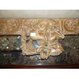 A CARVED AND PIERCED WALNUT PANEL TOGETHER WITH TWO MOULDED OAK AND PINE OVERDOOR CORNICES. (3)