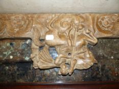 A CARVED AND PIERCED WALNUT PANEL TOGETHER WITH TWO MOULDED OAK AND PINE OVERDOOR CORNICES. (3)