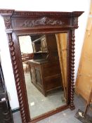 A LARGE 19th.C.CARVED OAK OVERMANTLE MIRROR WITH BARLEY TWIST UPRIGHTS.