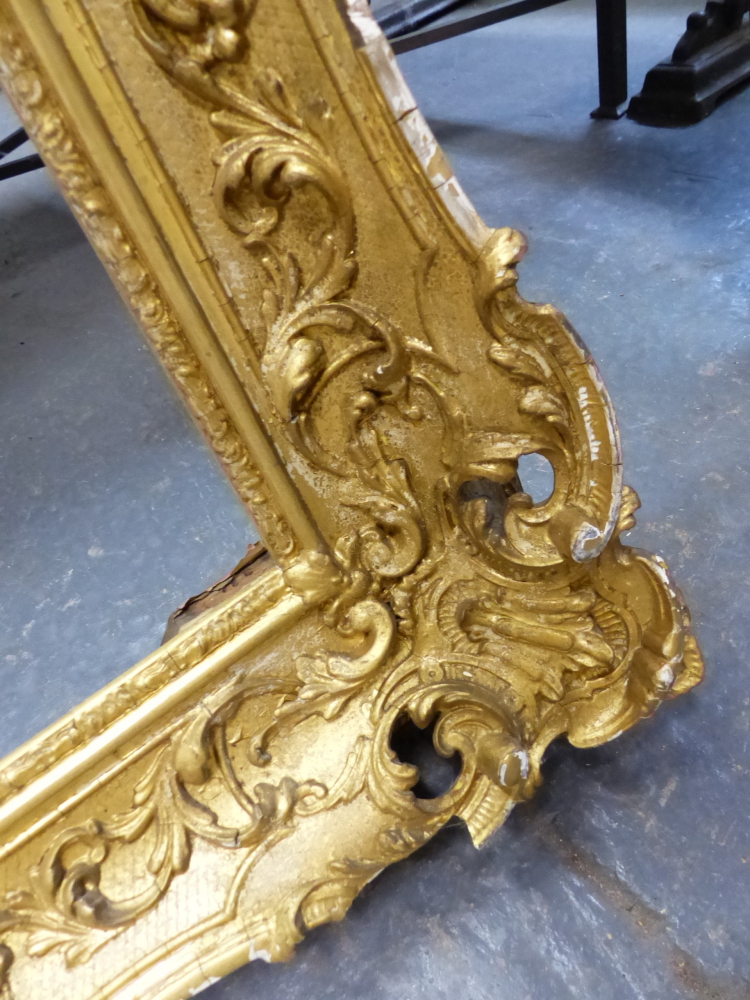 A LARGE VICTORIAN SWEPT GILT PICTURE FRAME IN THE FRENCH STYLE. REBATE 69 x 99.5cms. - Image 3 of 8