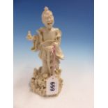 A BLANC DE CHINE FIGURE OF LIDIEHGUEI STANDING ON A ROCKY MOUND WITH A WALKING STICK IN HIS LEFT