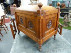 AN ARTS AND CRAFTS OAK COAL BOX WITH DOME LIFT TOP.