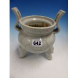 A CHINESE WHITE PORCELAIN TING, THE TWO HANDLED TRIPOD CENSER WITH THE GLAZE CRACKLED IN TWO TONES