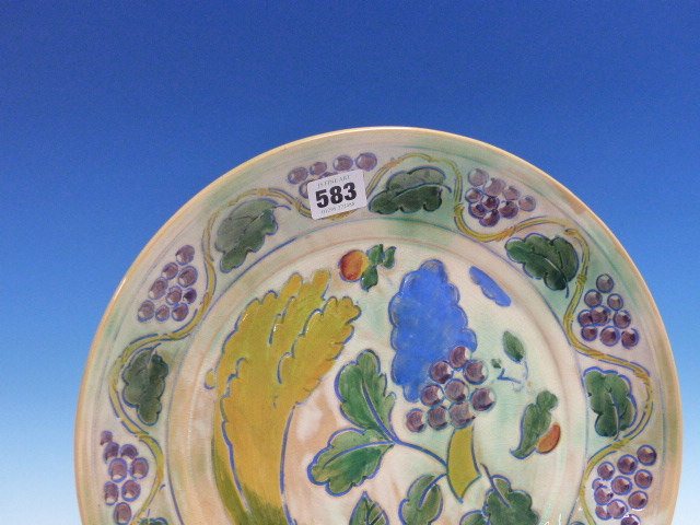 A DOULTON BRANGWYN WARE DISH WITH A WAVY BAND OF GRAPE VINES ENCLOSING A WHEATSHEAF, GRAPES AND - Image 2 of 10
