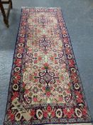 A PERSIAN FLORAL PATTERN SMALL RUNNER. 191 x 75cms.