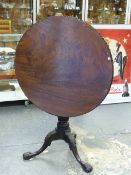 A GOOD 18th.C.MAHOGANY TRIPOD TABLE WITH TURNED AND CARVED COLUMN SUPPORT AND FOLIATE CARVED LEGS.