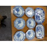 A SET OF SIX CHINESE BLUE AND WHITE OCTAGONAL PLATES PAINTED WITH A BRIDGE FROM AN ISLAND. W 22.5cms